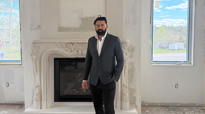 Photo of Sukhjinder Singh Rattan dressed in a suit